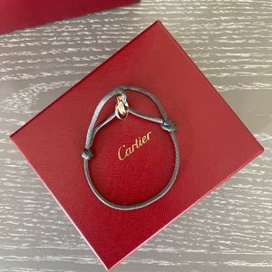 perfect condition trinity bracelet with dark grey chord